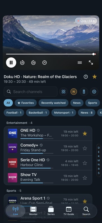 Neverlag’s home screen on iPhone: the current channel with the player bar and speedometer at the top, then search, filters such as Favourites, Football and News, and the channel list by group with time left